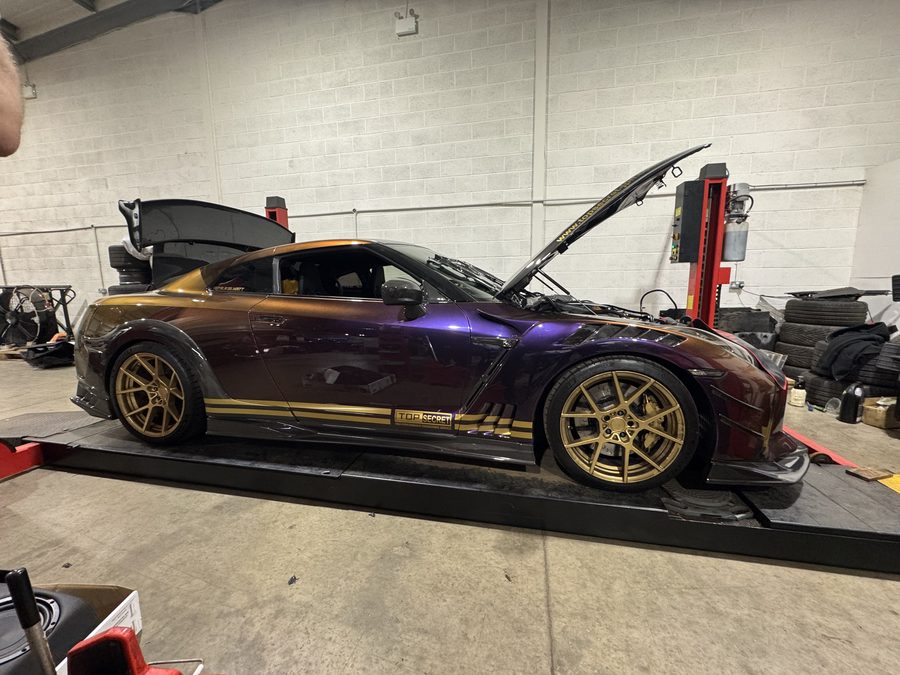 Top Secret Nissan R35 GT-R on a two-post ramp having KW HLS4 hydraulic lift coilovers fitted