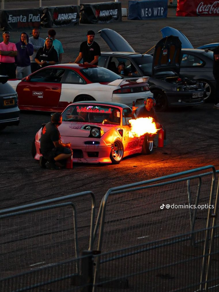 Lewis's pink Mazda MX-5 shooting flames at the flame-off competition at Santa Pod Raceway